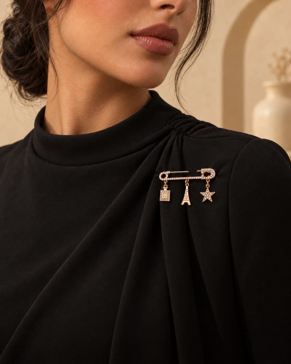Zia Charm Pin brooch styled on black dress by Tie Shop. بروش نسائي أنيق مثبت على فستان أسود لإطلالة السهرات والحجاب.