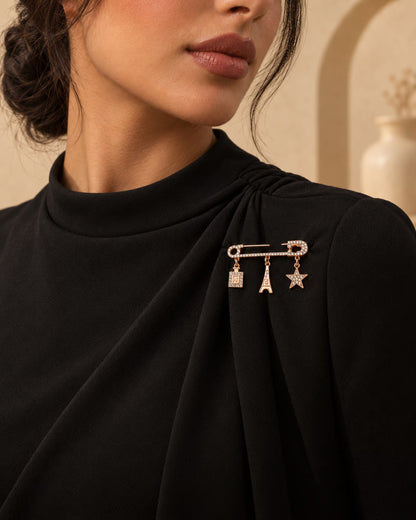 Zia Charm Pin brooch styled on black dress by Tie Shop. بروش نسائي أنيق مثبت على فستان أسود لإطلالة السهرات والحجاب.