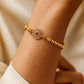 Tie Shop Classic Bracelet in gold with crystal pave circle charm detail. أساور نسائية من تاي شوب كلاسيك براسليت بخرز ذهبي ودلاية دائرية مرصعة، مجوهرات وإكسسوارات أنيقة.