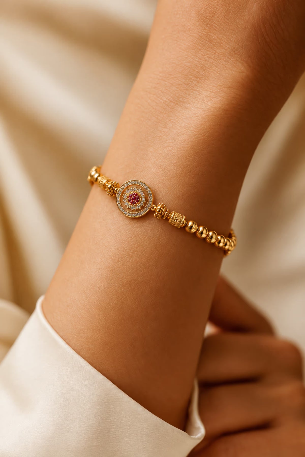 Tie Shop Classic Bracelet in gold with crystal pave circle charm detail. أساور نسائية من تاي شوب كلاسيك براسليت بخرز ذهبي ودلاية دائرية مرصعة، مجوهرات وإكسسوارات أنيقة.